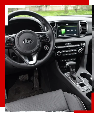 Салон Kia Sportage: руль и приборная панель